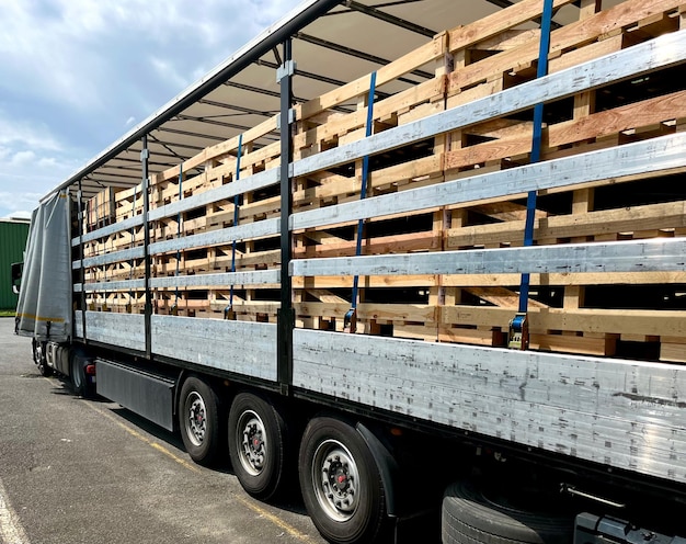 Transportation of car parts in wooden boxes in a semitrailer truck