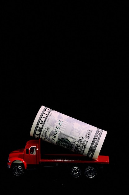 Transportation of Money for the Red Toy Truck Business Concept