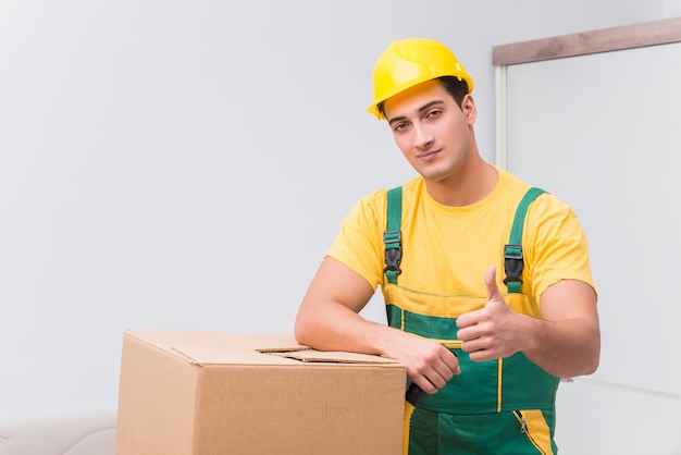 Photo transportation worker delivering boxes to house