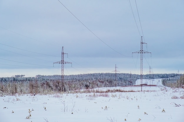 Transposition power transmission towers in snowy north forest