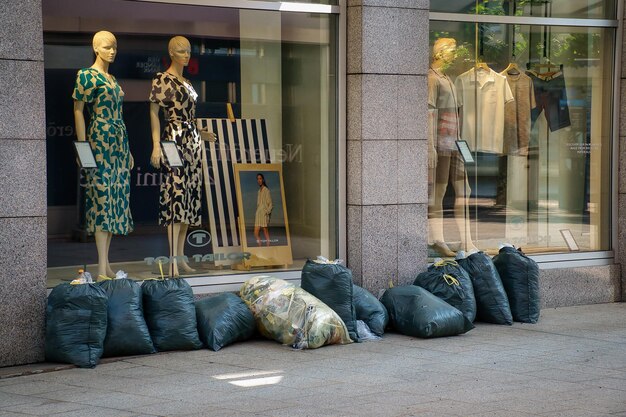 Photo trash bags outside a clothing store window in bregenz austria