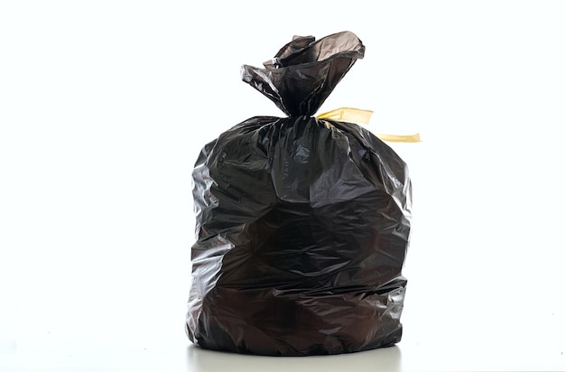 Trash black garbage bag full and tied isolated against white background