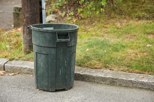 Trashcan and garbage bin outdoor in the street symbolizing environmental protection recycling and di