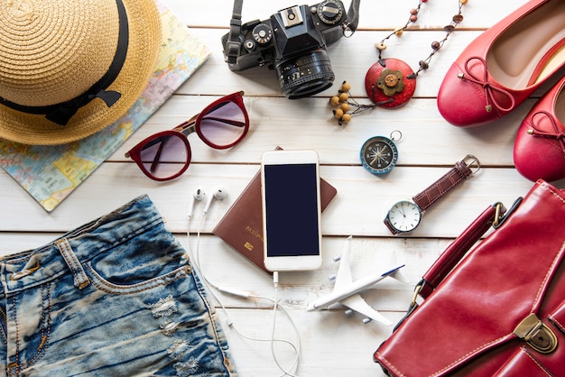 travel accessories and costume on wooden floor