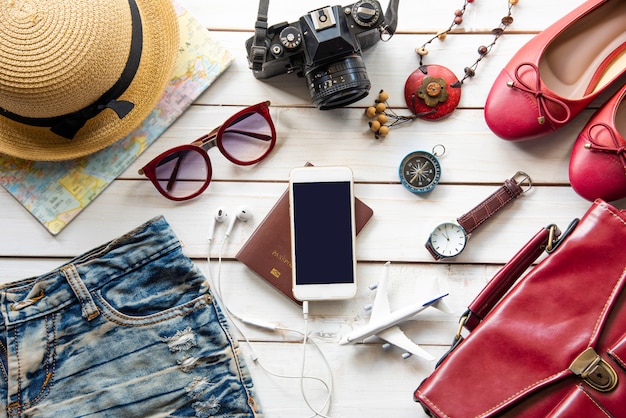 Travel accessories and costume on wooden floor