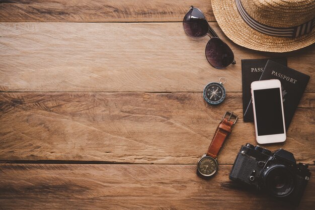 Travel accessories on wooden floor ready for travel