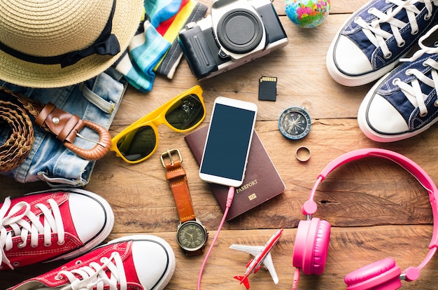 Travel accessories on wooden floor ready for travel