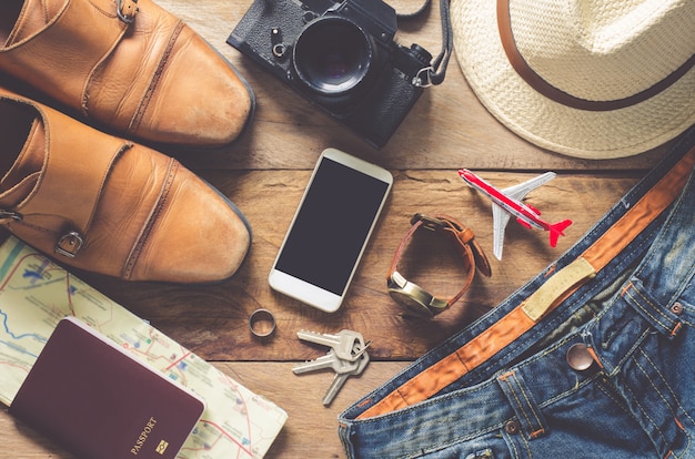 Travel accessories on wooden floor ready for travel