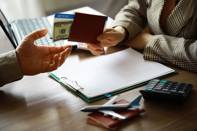 Travel agent receiving money from client for provided service in office