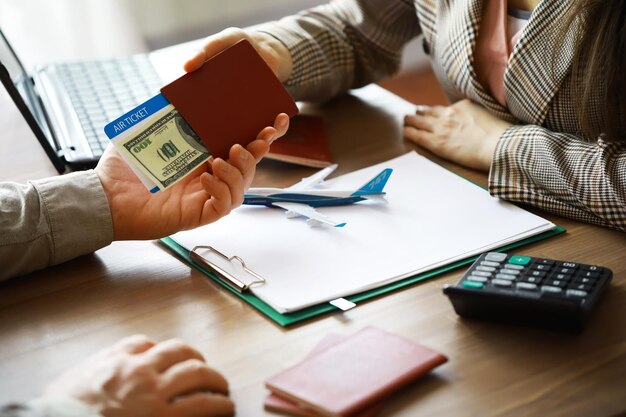 Travel agent receiving money from client for provided service in office