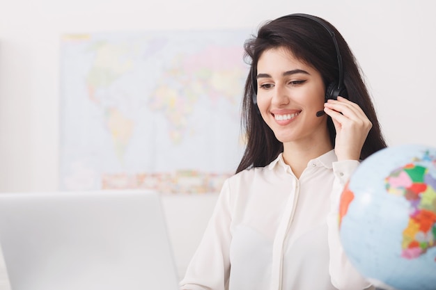 Travel agent speaking to customer in the office