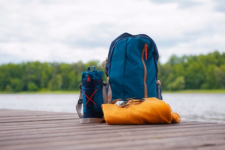 Travel bags on the pier, near the shore