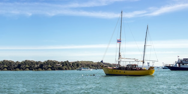 Travel boat ship of tourism passenger in holiday trip of Thai ocean