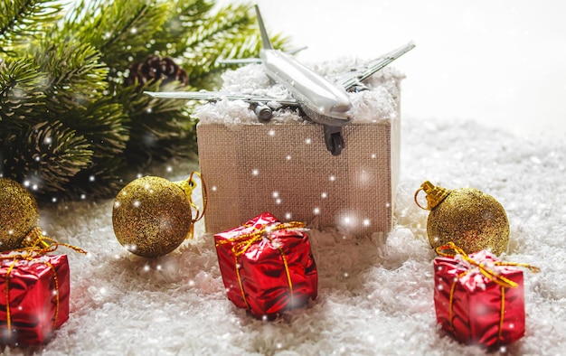 Travel for Christmas. Airplane with Christmas decor.New year.Selective focus.