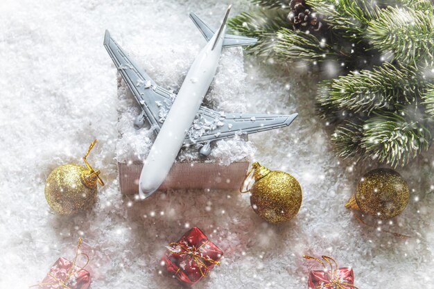 Travel for Christmas. Airplane with Christmas decor.New year.Selective focus.