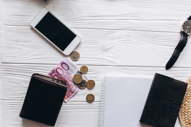 Travel concept,  documents, hat, compass, money, phone and camera on a white  background