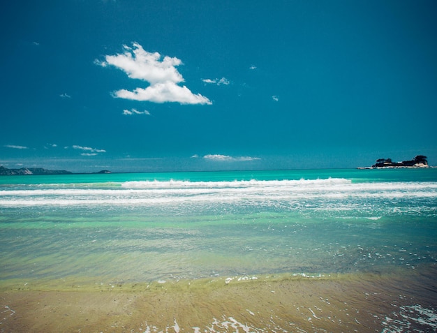 Travel concept - sandy beach at summer sunny day