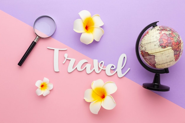 Photo travel concept with flowers and globe