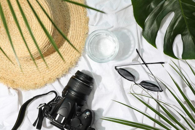 Travel female accessories on white cloth