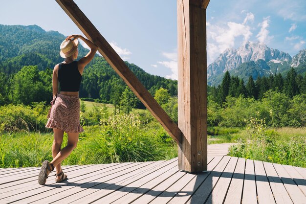 Travel Freedom Lifestyle concept Young woman enjoying green nature outdoors