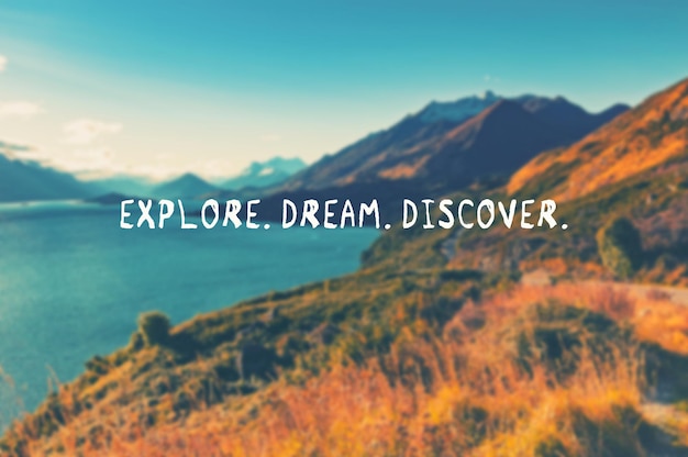 Travel inspirational quotes Explore Dream Discover Retro styled blurry background