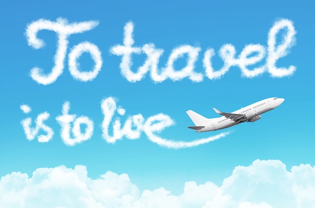 To travel is to live - phrase drawn from clouds airplane in the blue sky, concept travel tourism holiday vacation.