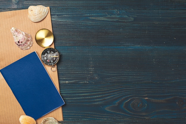 Travel items on wooden table.