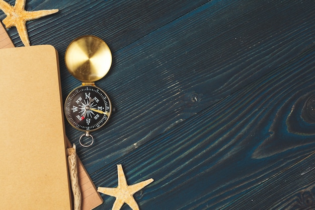 Travel items on wooden table.