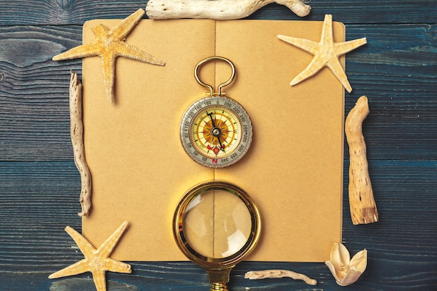 Photo travel items on wooden table.