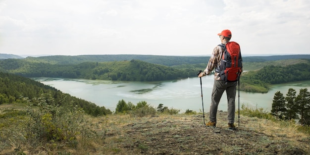 Travel lifestyle wanderlust adventure concept summer vacations outdoor Man hiking in countryside