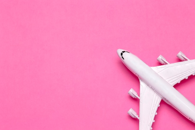 Travel minimal background. Model airplane in flight on an empty colored background. Copy space