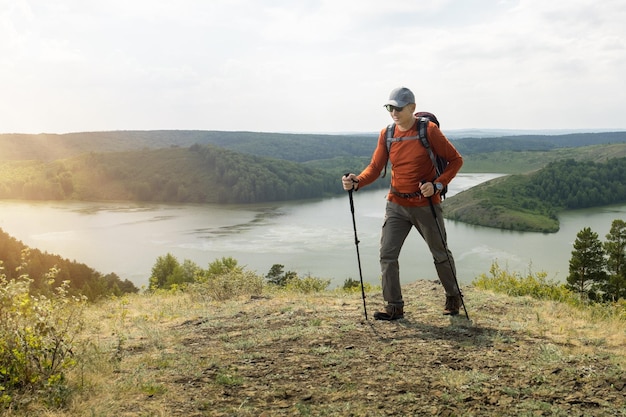 travel in the mountains with backpack happy man hiker hiking in mountains