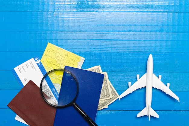 Travel objects on wooden background