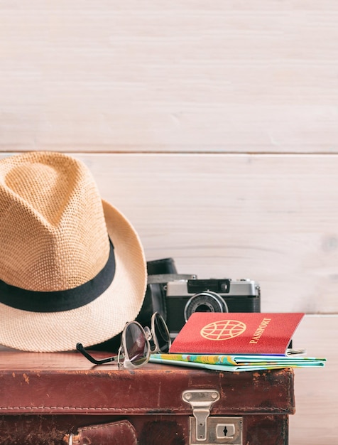 Travel packing concept vintage suitcase and passport on white background copy space