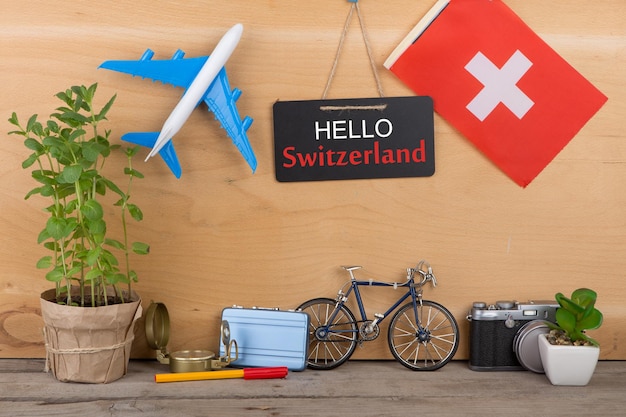 Travel time blackboard with text love switzerland flag of the switzerland airplane model camera