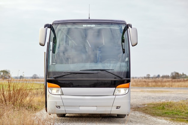 Photo travel, tourism, road trip and passenger transport - tour bus staying outdoors