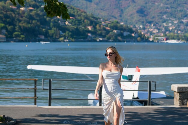 Travel tourist woman in como lake italy europe girl on summer vacation visiting famous tourist desti