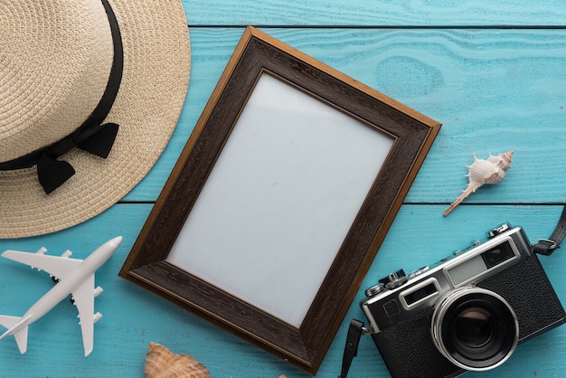 Travel and vacation items on wooden table