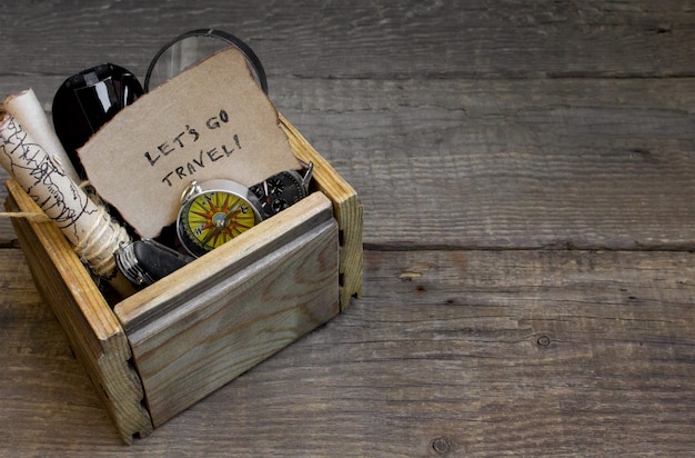 Travel and vacation, wooden box table background, compass, map