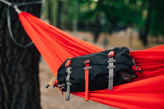 Travel waist bag lies on a magic hammock in the woods