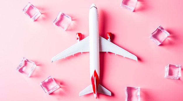 Travel warm summer concept Model of airplane on pink background with passport