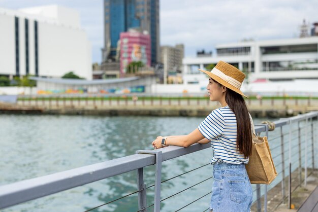 Travel woman look at the sea in Keelung harbor