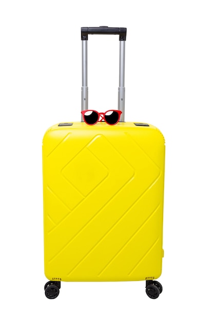 Photo travel yellow suitcase with sunglasses and red hat isolated on white background.with clipping path