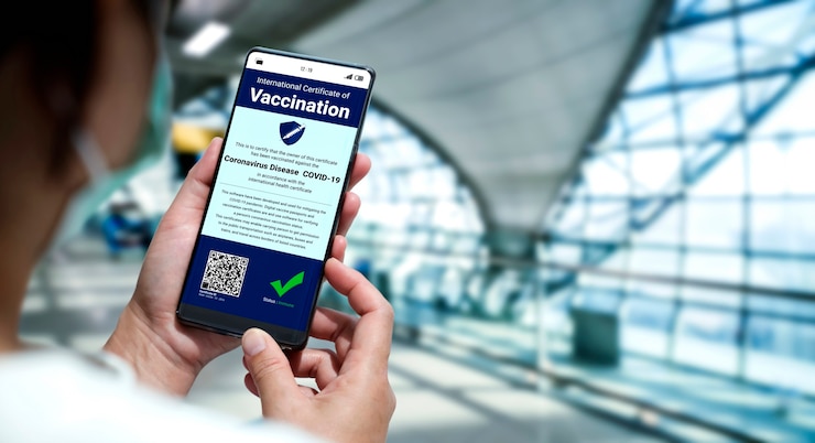 Photo traveler holds vaccine passport certificate to show covid 19 vaccination status