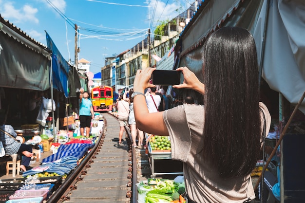 Traveler in Mae Klong railway market