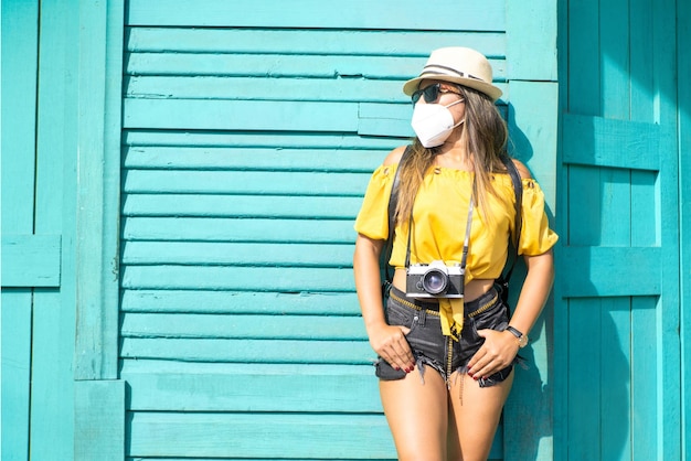 Traveler photographer wearing a face mask on the street