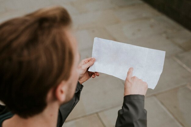 Traveler reading a blank document