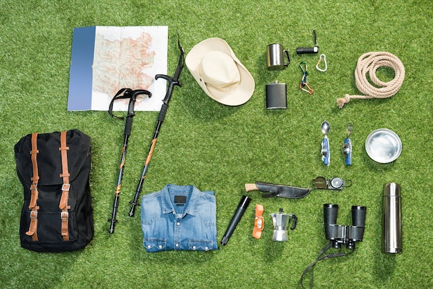 Photo traveler set on grassy background flat lay