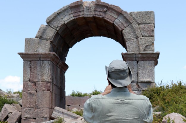 Traveler taking a photo at the Bozkir Zengibar Castle ruins