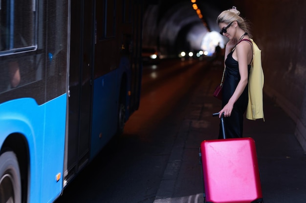 Traveler tourist woman with suitcase outdoor tourist girl with travel bag travelling traveling in eu